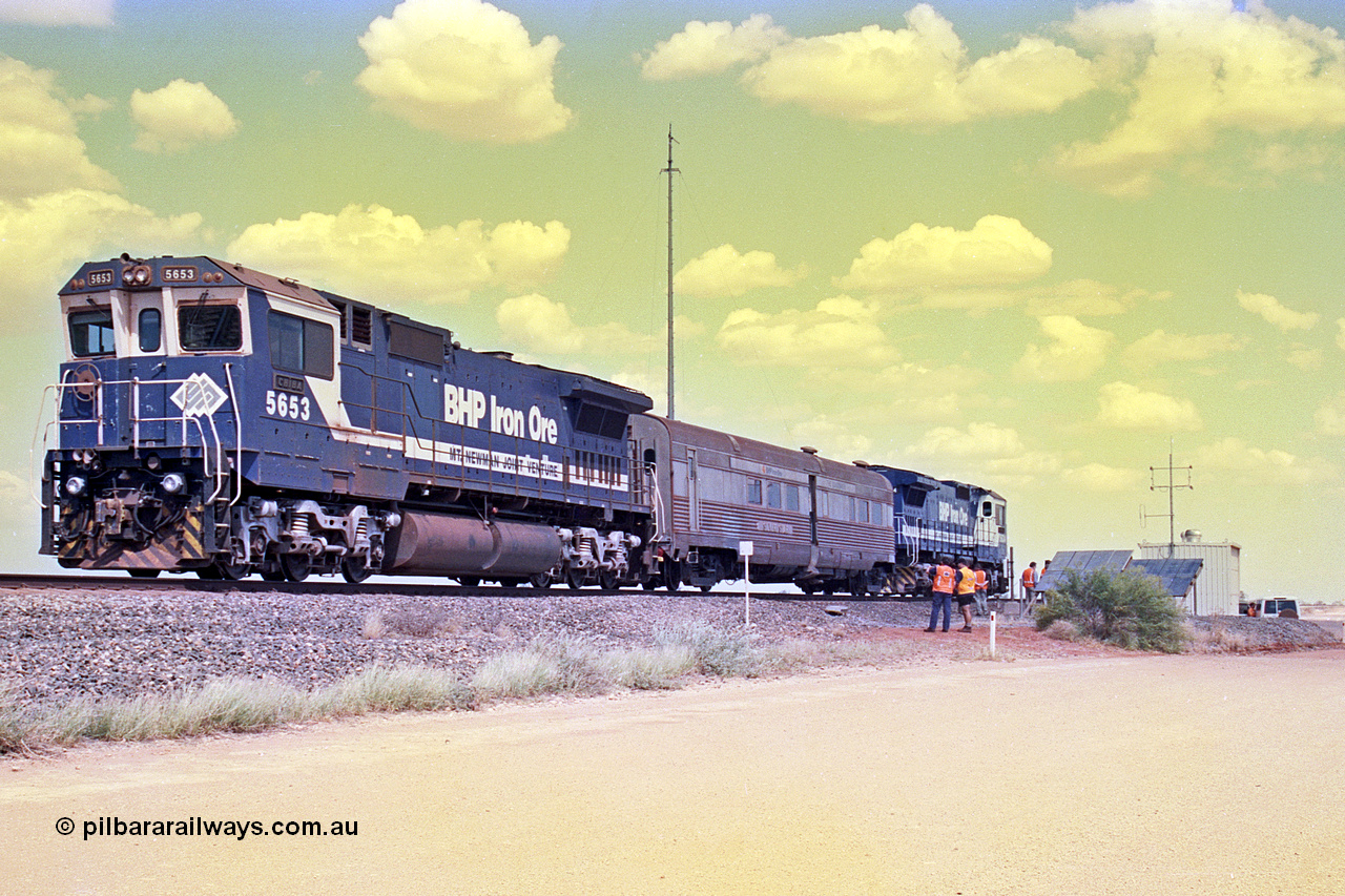 268-08
At the 39 km detection site with the Alstom 25-year service agreement special, BHP Iron Ore's Goninan GE rebuild CM40-8M unit 5653 'Chiba' serial number 8412-10 / 93-144 stands on the Newman mainline with The Sundowner and 5634 on the rear of the train as the party conducts an inspection of the site. Friday 12th of April 2002.
Keywords: 5653;Goninan;GE;CM40-8M;8412-10/93-144;rebuild;AE-Goodwin;ALCo;M636C;5484;G6061-5;