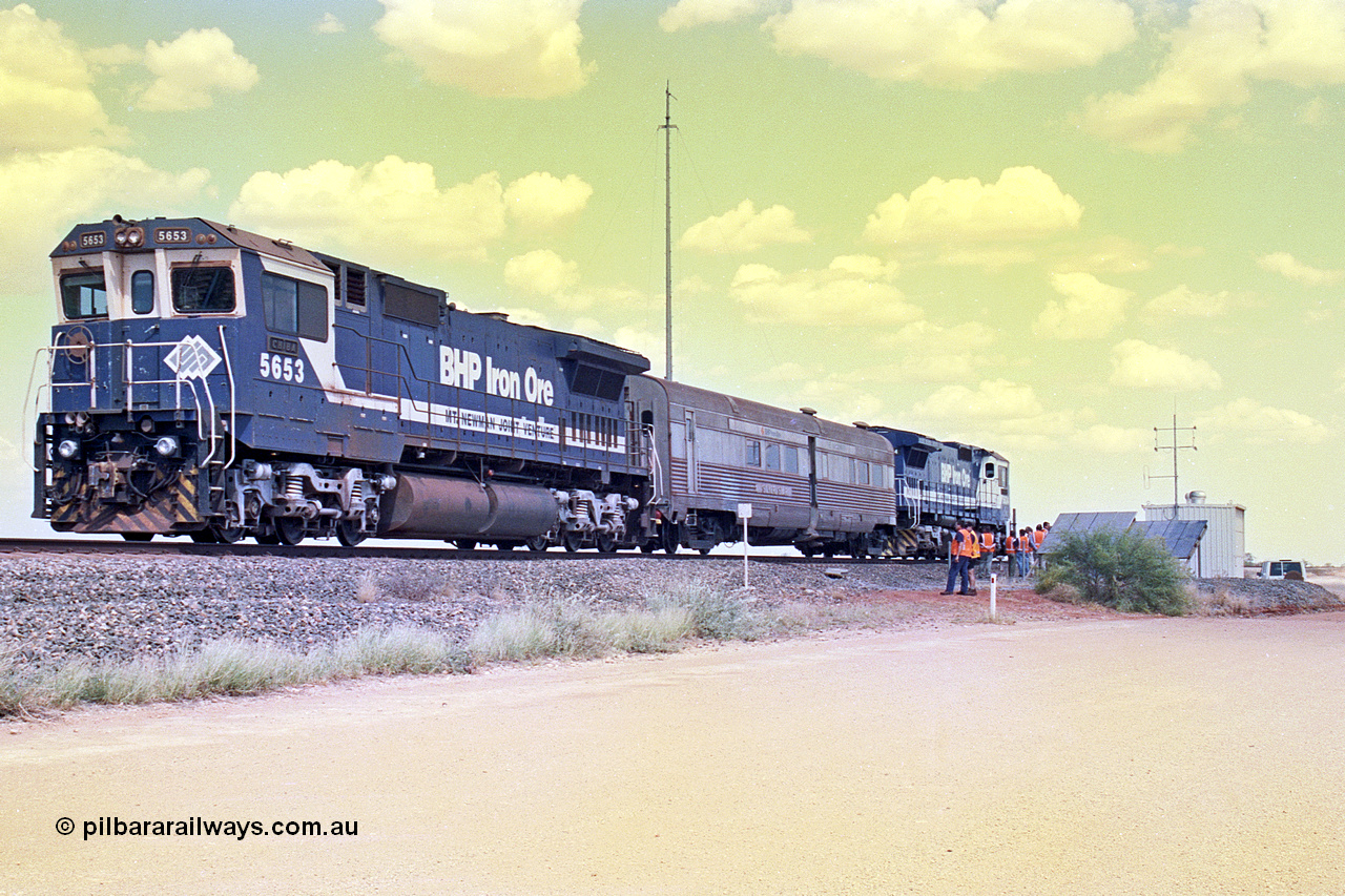 268-09
At the 39 km detection site with the Alstom 25-year service agreement special, BHP Iron Ore's Goninan GE rebuild CM40-8M unit 5653 'Chiba' serial number 8412-10 / 93-144 stands on the Newman mainline with The Sundowner and 5634 on the rear of the train as the party conducts an inspection of the site. Friday 12th of April 2002.
Keywords: 5653;Goninan;GE;CM40-8M;8412-10/93-144;rebuild;AE-Goodwin;ALCo;M636C;5484;G6061-5;