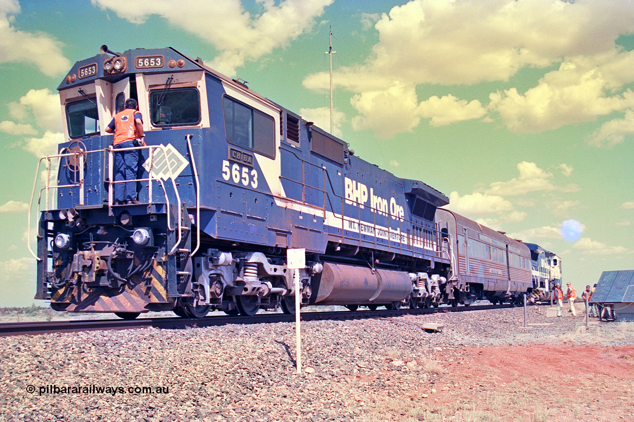 268-24
At the 39 km detection site with the Alstom 25-year service agreement special, BHP Iron Ore's Goninan GE rebuild CM40-8M unit 5653 'Chiba' serial number 8412-10 / 93-144 stands on the Newman mainline with The Sundowner and 5634 on the rear of the train as the party conducts an inspection of the site. Friday 12th of April 2002.
Keywords: 5653;Goninan;GE;CM40-8M;8412-10/93-144;rebuild;AE-Goodwin;ALCo;M636C;5484;G6061-5;