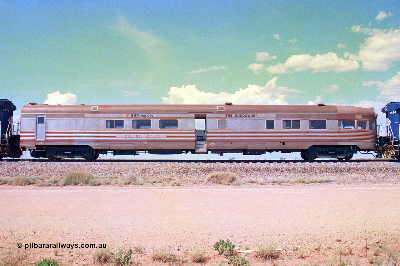 268-29
At the 39 km detection site with the Alstom 25-year special, left hand side view of the Sundowner coach, originally built by E. G. Budd in 1939 numbered 301 as the Silver Star, a diner-parlour-observation coach on the Chicago, Burlington and Quincy Railroad's General Pershing Zephyr train from the 1930s and 1940s. Donated to Mt Newman Mining Co. by AMAX an original joint venture partner to commemorate the projects first 100 million tonnes of iron ore railed between Mount Whaleback mine and the Port Hedland port. 12th of April 2002.
Keywords: Silver-Star;EG-Budd;Sundowner;General-Pershing-Zephyr;301;