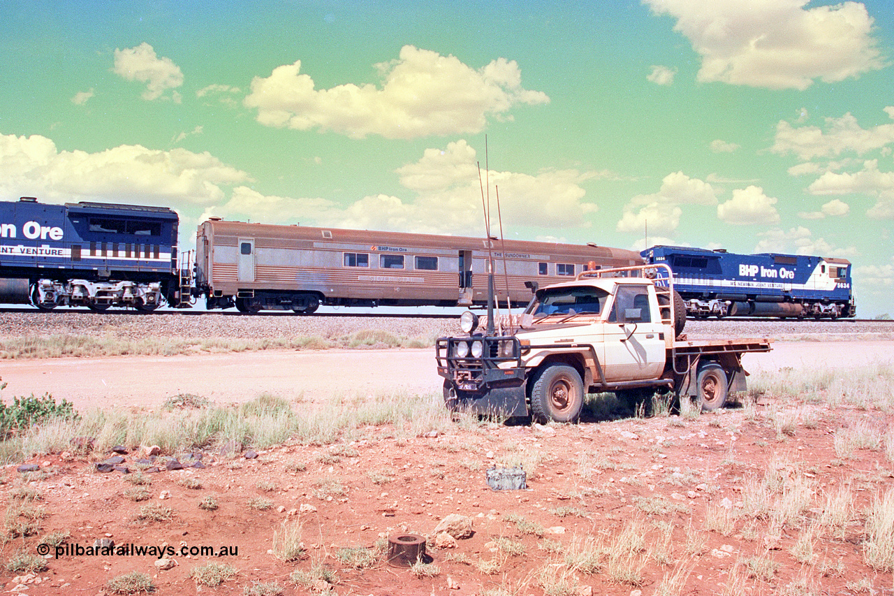 268-36
At the 39 km detection site with the Alstom 25-year special, the Sundowner coach, originally built by E. G. Budd in 1939 numbered 301 as the Silver Star, a diner-parlour-observation coach on the Chicago, Burlington and Quincy Railroad's General Pershing Zephyr train from the 1930s and 1940s. Donated to Mt Newman Mining Co. by AMAX an original joint venture partner to commemorate the projects first 100 million tonnes of iron ore railed between Mount Whaleback mine and the Port Hedland port. 12th of April 2002.
Keywords: Silver-Star;EG-Budd;Sundowner;General-Pershing-Zephyr;301;