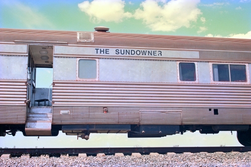 268-18
At the 39 km detection site with the Alstom 25-year special, the Sundowner coach, originally built by E. G. Budd in 1939 numbered 301 as the Silver Star, a diner-parlour-observation coach on the Chicago, Burlington and Quincy Railroad's General Pershing Zephyr train from the 1930s and 1940s. Donated to Mt Newman Mining Co. by AMAX an original joint venture partner to commemorate the projects first 100 million tonnes of iron ore railed between Mount Whaleback mine and the Port Hedland port. April 12, 2002.
Keywords: Silver-Star;EG-Budd;Sundowner;General-Pershing-Zephyr;301;