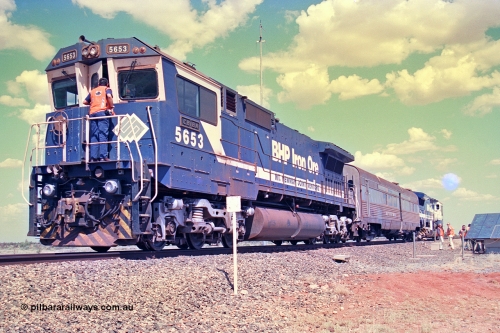 268-24
At the 39 km detection site with the Alstom 25-year service agreement special, BHP Iron Ore's Goninan GE rebuild CM40-8M unit 5653 'Chiba' serial number 8412-10 / 93-144 stands on the Newman mainline with The Sundowner and 5634 on the rear of the train as the party conducts an inspection of the site. Friday April 12, 2002.
Keywords: 5653;Goninan;GE;CM40-8M;8412-10/93-144;rebuild;AE-Goodwin;ALCo;M636C;5484;G6061-5;