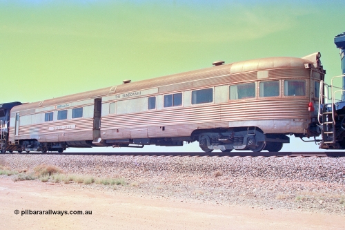 268-32
At the 39 km detection site with the Alstom 25-year special, view from the No. 2 End of the Sundowner coach, originally built by E. G. Budd in 1939 numbered 301 as the Silver Star, a diner-parlour-observation coach on the Chicago, Burlington and Quincy Railroad's General Pershing Zephyr train from the 1930s and 1940s. Donated to Mt Newman Mining Co. by AMAX an original joint venture partner to commemorate the projects first 100 million tonnes of iron ore railed between Mount Whaleback mine and the Port Hedland port. April 12, 2002.
Keywords: Silver-Star;EG-Budd;Sundowner;General-Pershing-Zephyr;301;