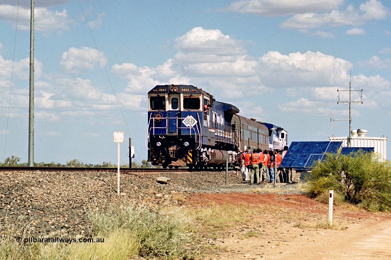 269-02
At the 39 km detection site with the Alstom 25-year service agreement special, BHP Iron Ore's Goninan GE rebuild CM40-8M unit 5653 'Chiba' serial number 8412-10 / 93-144 stands on the Newman mainline with The Sundowner and 5634 on the rear of the train as the party conducts an inspection of the site. Friday 12th of April 2002.
Keywords: 5653;Goninan;GE;CM40-8M;8412-10/93-144;rebuild;AE-Goodwin;ALCo;M636C;5484;G6061-5;