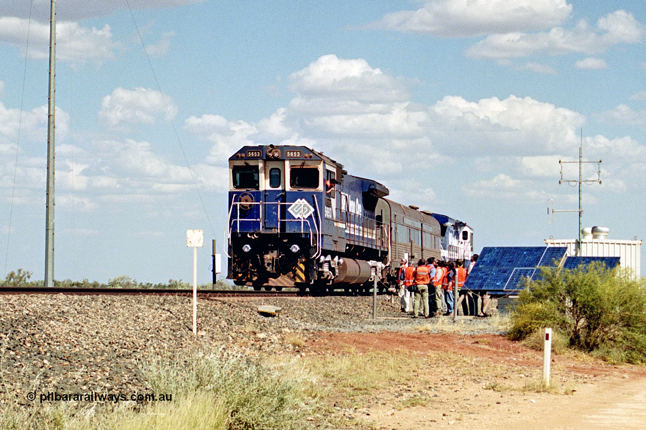 269-03
At the 39 km detection site with the Alstom 25-year service agreement special, BHP Iron Ore's Goninan GE rebuild CM40-8M unit 5653 'Chiba' serial number 8412-10 / 93-144 stands on the Newman mainline with The Sundowner and 5634 on the rear of the train as the party conducts an inspection of the site. Friday 12th of April 2002.
Keywords: 5653;Goninan;GE;CM40-8M;8412-10/93-144;rebuild;AE-Goodwin;ALCo;M636C;5484;G6061-5;