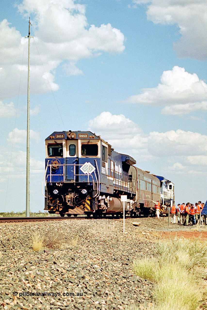 269-04
At the 39 km detection site with the Alstom 25-year service agreement special, BHP Iron Ore's Goninan GE rebuild CM40-8M unit 5653 'Chiba' serial number 8412-10 / 93-144 stands on the Newman mainline with The Sundowner and 5634 on the rear of the train as the party conducts an inspection of the site. Friday 12th of April 2002.
Keywords: 5653;Goninan;GE;CM40-8M;8412-10/93-144;rebuild;AE-Goodwin;ALCo;M636C;5484;G6061-5;