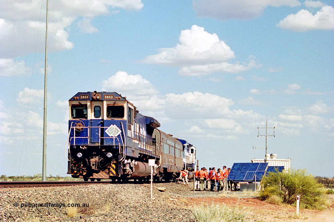 269-05
At the 39 km detection site with the Alstom 25-year service agreement special, BHP Iron Ore's Goninan GE rebuild CM40-8M unit 5653 'Chiba' serial number 8412-10 / 93-144 stands on the Newman mainline with The Sundowner and 5634 on the rear of the train as the party conducts an inspection of the site. Friday 12th of April 2002.
Keywords: 5653;Goninan;GE;CM40-8M;8412-10/93-144;rebuild;AE-Goodwin;ALCo;M636C;5484;G6061-5;