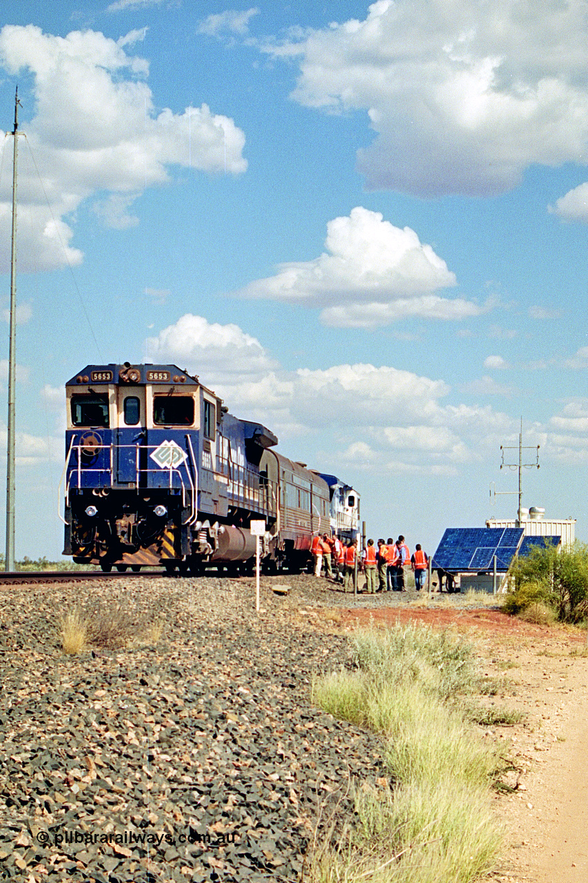 269-06
At the 39 km detection site with the Alstom 25-year service agreement special, BHP Iron Ore's Goninan GE rebuild CM40-8M unit 5653 'Chiba' serial number 8412-10 / 93-144 stands on the Newman mainline with The Sundowner and 5634 on the rear of the train as the party conducts an inspection of the site. Friday 12th of April 2002.
Keywords: 5653;Goninan;GE;CM40-8M;8412-10/93-144;rebuild;AE-Goodwin;ALCo;M636C;5484;G6061-5;