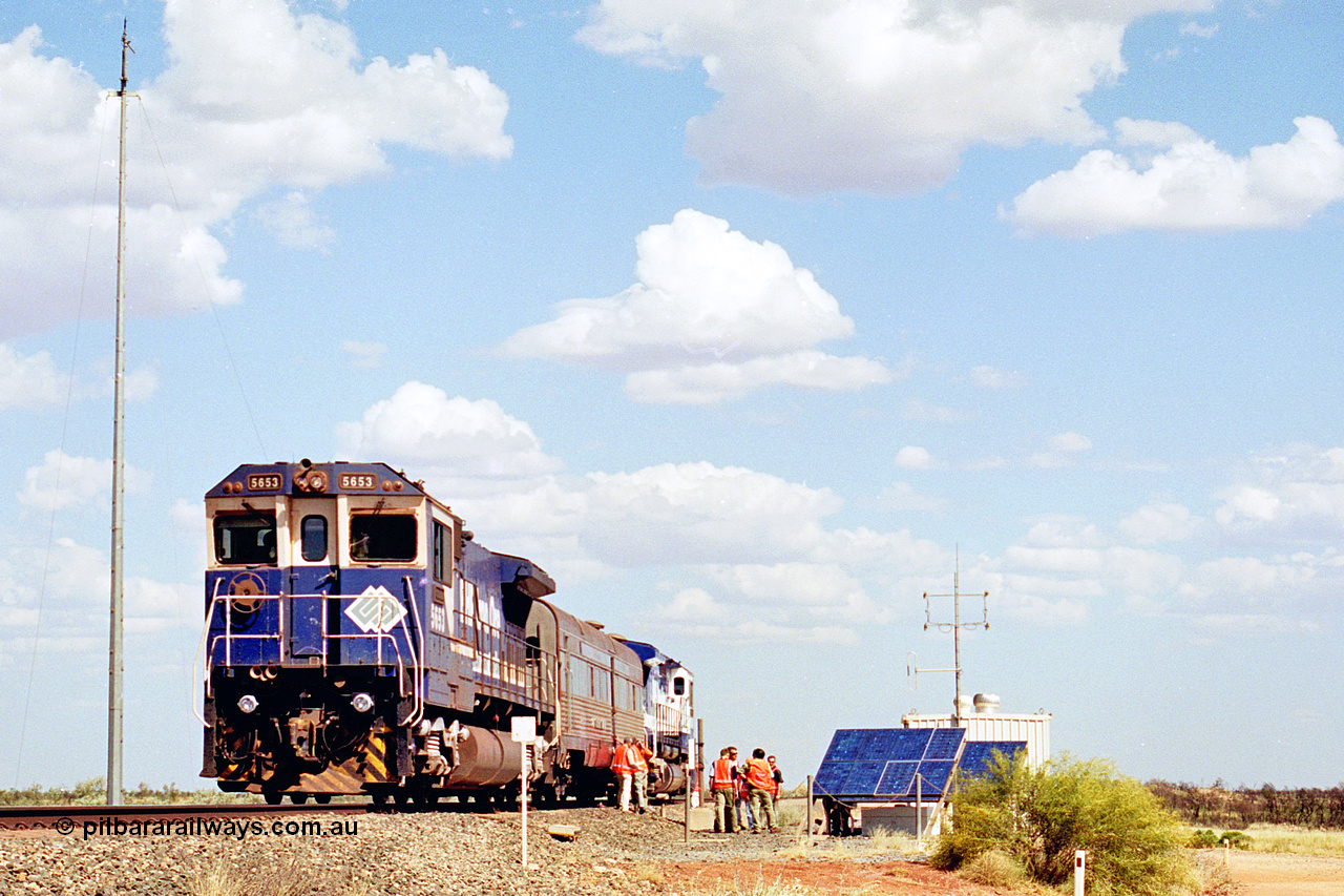 269-08
At the 39 km detection site with the Alstom 25-year service agreement special, BHP Iron Ore's Goninan GE rebuild CM40-8M unit 5653 'Chiba' serial number 8412-10 / 93-144 stands on the Newman mainline with The Sundowner and 5634 on the rear of the train as the party conducts an inspection of the site. Friday 12th of April 2002.
Keywords: 5653;Goninan;GE;CM40-8M;8412-10/93-144;rebuild;AE-Goodwin;ALCo;M636C;5484;G6061-5;