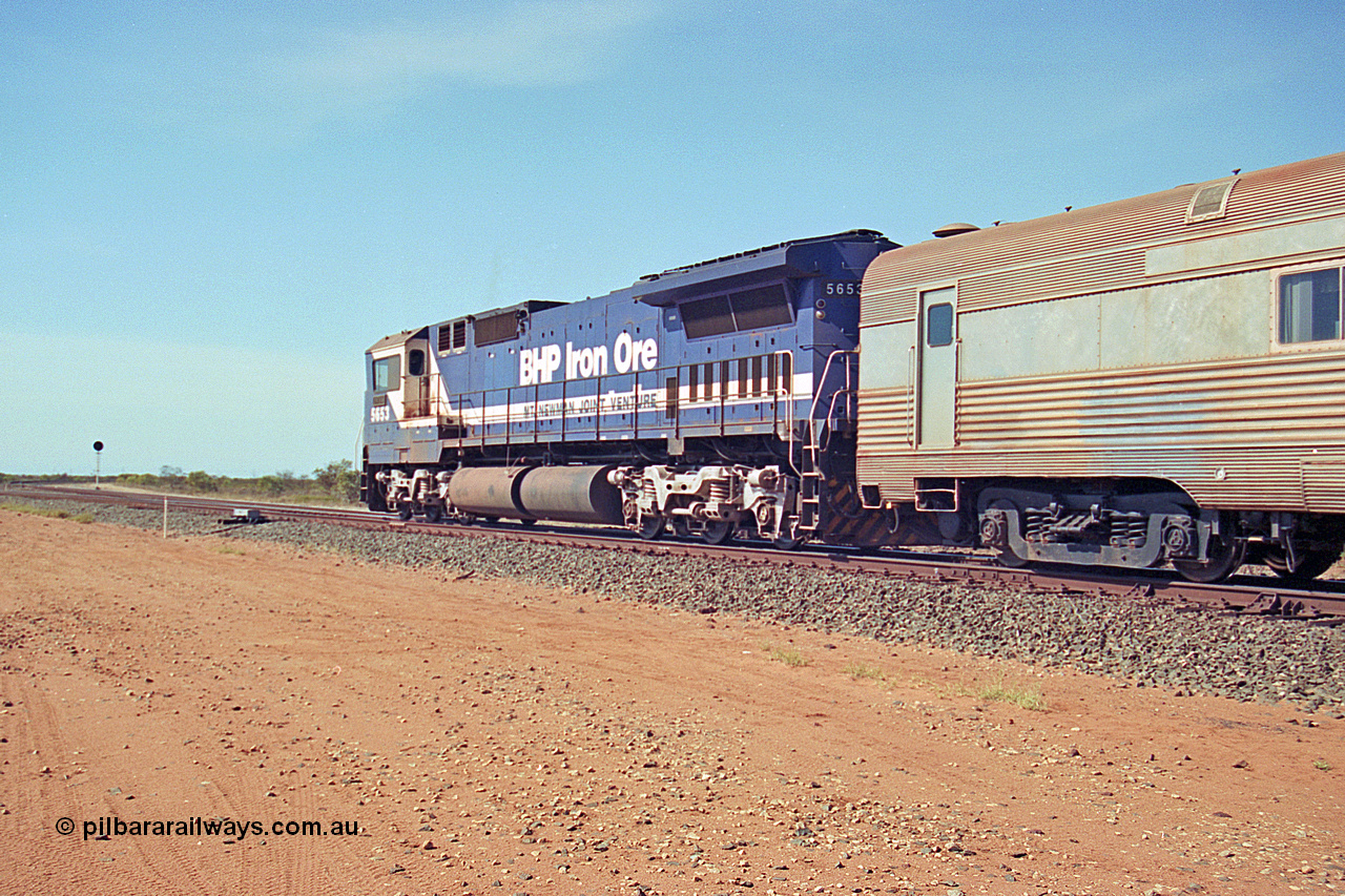 269-24
Goldsworthy Junction, and the Alstom 25-year service agreement special led by BHP Iron Ore's Goninan GE rebuild CM40-8M unit 5653 'Chiba' serial number 8412-10 / 93-144 heads back to Nelson Point with The Sundowner and 5634 on the rear of the train. Friday 12th of April 2002.
Keywords: 5653;Goninan;GE;CM40-8M;8412-10/93-144;rebuild;AE-Goodwin;ALCo;M636C;5484;G6061-5;