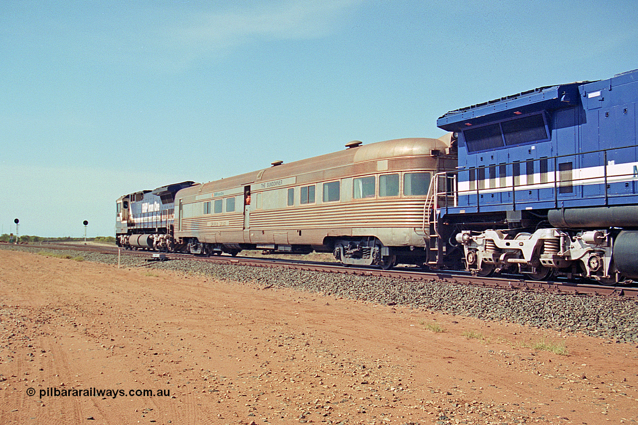 269-25
Goldsworthy Junction, and the Alstom 25-year service agreement special led by BHP Iron Ore's Goninan GE rebuild CM40-8M unit 5653 'Chiba' serial number 8412-10 / 93-144 heads back to Nelson Point with The Sundowner and 5634 on the rear of the train. Friday 12th of April 2002.
Keywords: Silver-Star;EG-Budd;Sundowner;General-Pershing-Zephyr;301;