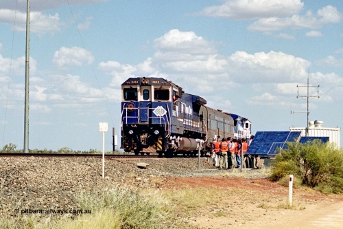 269-03
At the 39 km detection site with the Alstom 25-year service agreement special, BHP Iron Ore's Goninan GE rebuild CM40-8M unit 5653 'Chiba' serial number 8412-10 / 93-144 stands on the Newman mainline with The Sundowner and 5634 on the rear of the train as the party conducts an inspection of the site. Friday April 12, 2002.
Keywords: 5653;Goninan;GE;CM40-8M;8412-10/93-144;rebuild;AE-Goodwin;ALCo;M636C;5484;G6061-5;
