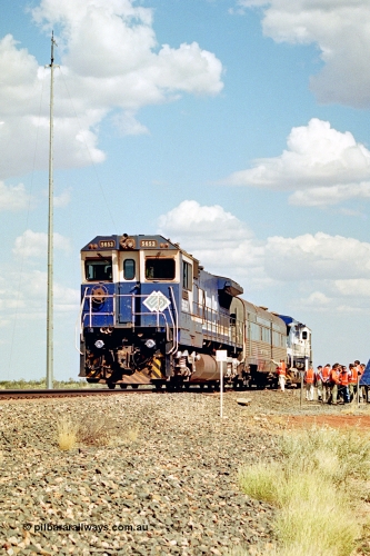 269-04
At the 39 km detection site with the Alstom 25-year service agreement special, BHP Iron Ore's Goninan GE rebuild CM40-8M unit 5653 'Chiba' serial number 8412-10 / 93-144 stands on the Newman mainline with The Sundowner and 5634 on the rear of the train as the party conducts an inspection of the site. Friday April 12, 2002.
Keywords: 5653;Goninan;GE;CM40-8M;8412-10/93-144;rebuild;AE-Goodwin;ALCo;M636C;5484;G6061-5;