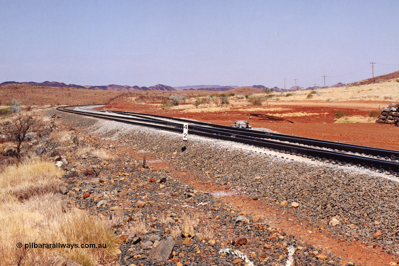 283-12
Harding Siding on the Robe River line at the 42 kilometre post looking in the down direction towards Deepdale. Recently extended north end of the siding to accommodate the soon to be West Angelas traffic and longer trains. 22nd of May 2002.
