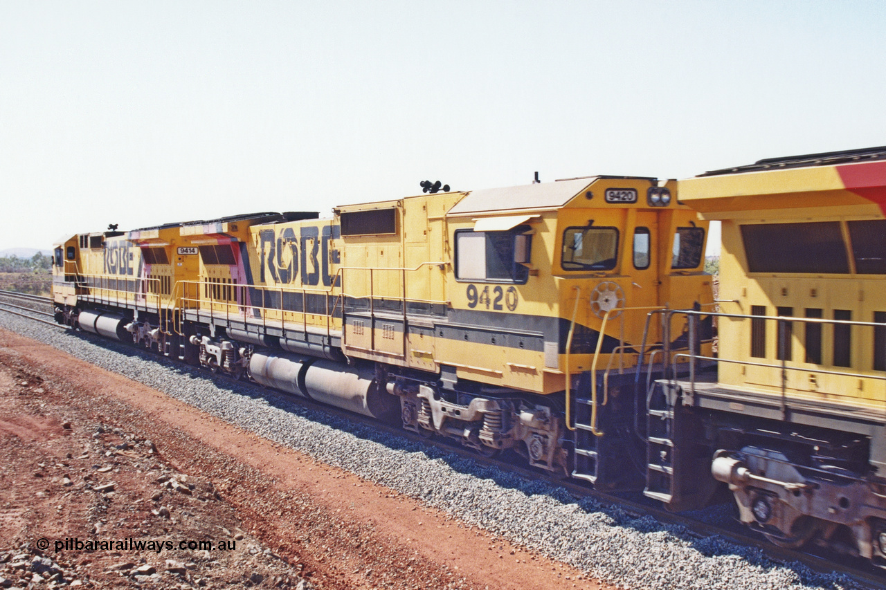 283-24
Harding Siding, Robe River locomotive 9420 which is a Goninan WA ALCo to GE rebuild CM40-8M with serial 8109-03 / 91-119 from March 1991 riding on Hi-Ad bogies and was originally an ALCo Schenectady built C630 serial 3486-4 and built new for Chesapeake & Ohio (USA) as their 2103. It is one of four C630 ALCo units purchased in 1974 and delivered to Robe in January 1975. Everything below the frame is ALCo while above is GE and Pilbara Cab. 22nd May 2002.
Keywords: 9420;Goninan;GE;CM40-8M;8109-03/91-119;rebuild;ALCo;C630;3486-4;C+O;2103;