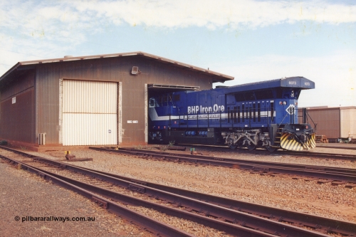 283-01
Nelson Point, BHP wheel lathe sees BHP's big GE AC6000 unit 6073 'Fortescue' serial number 51065 on shed having wheel attention to the leading bogie. May 2002.
Keywords: 6073;GE;AC6000CW;51065;