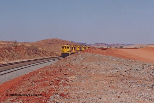 283-17
Harding Siding, quad Robe River CM40-8M units 9414, 9420, 9410 and 9425 lead 202 loaded ore waggons at Siding 1 (Harding). The siding has recently been renamed Harding and extended at the north end to accommodate the new West Angelas trains of up to 240 waggons. Wednesday 22nd May 2002.
Keywords: 9414;Goninan;GE;CM40-8M;8206-11/91-124;rebuild;AE-Goodwin;ALCo;M636;G6060-5;