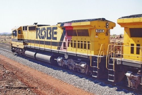 283-23
Harding Siding, Robe River's Goninan GE rebuild CM40-8M unit 9414 serial number 8206-11 / 91-124 leads the typical quad power with 9420, 9410 and 9425 as they run along the loop road as part of the bedding down process. 9414 was rebuilt from AE Goodwin built M636 ALCo model with original serial number G-6060-5 from 1971. Wednesday 22nd May 2002.
Keywords: 9414;Goninan;GE;CM40-8M;8206-11/91-124;rebuild;AE-Goodwin;ALCo;M636;G6060-5;