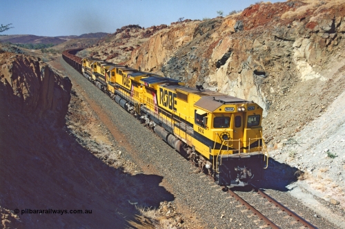 283-33
Near Woodbrook as quad Robe River CM40-8M units 9414, 9420, 9410 and 9525 work a loaded 202 waggons bound for Cape Lambert as they power through the cutting up a short grade at the 37.5 km pipe bridge. 9414 with serial number 8206-11 / 91-124 was rebuilt by Goninan in 1991 from AE Goodwin built M636 ALCo model with original serial number G-6060-5 from 1971. May 22, 2002.
Keywords: 9414;Goninan;GE;CM40-8M;8206-11/91-124;rebuild;AE-Goodwin;ALCo;M636;G6060-5;