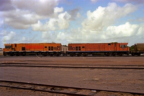 284-10
Narngulu, Geraldton, former Westrail P class loco P 2014 'Shire of Wongan-Ballidu' built by Goninan WA as a GE CM25-8 model with serial number 6320-12 / 90-099 sits in the yard on empty grain waggons with sister loco P 2003. November 9, 2004.
Keywords: P-class;P2014;Goninan-WA;GE;CM25-8;6320-12/90-099;