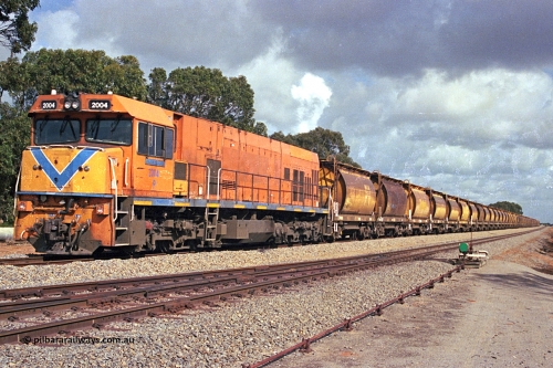284-19
Narngulu, Geraldton, former Westrail P class loco P 2004 'Shire of Dalwallinu' built by Goninan WA as a GE CM25-8 model with serial number 6320-12 / 90-099 sits in the yard on empty mineral sand train waiting to run to Eneabba. November 9, 2004.
Keywords: P-class;P2004;Goninan-WA;GE;CM25-8;6320-03/90-089;
