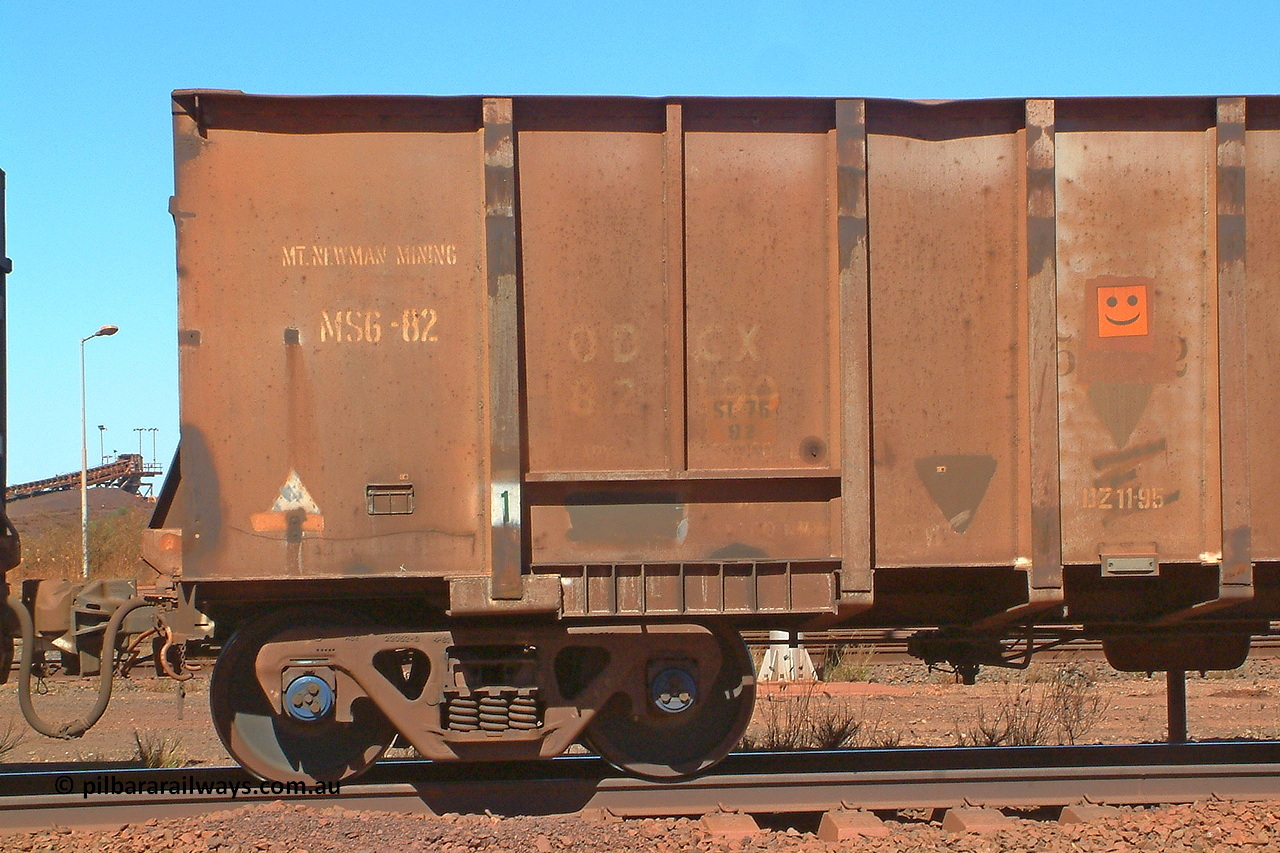 030712 142552
Nelson Point, empty BHP ore waggon 553, one of the original Magor USA build waggons bought out at construction of the Mt Newman project. Visible is the ODCX code and number 82190 from the Oroville Dam Construction company days in the USA. Unsure of the MS6-82 code, the DZ 11-95 code was the late time it was internally painted to reduce wear and the SL 76 with 92 below it was the last time the Miner SL-76 draft gear was replaced. The orange smiley sticker indicates that this is an original 'Oroville Dam' ore waggon and non relayed AB braked. 12th of July 2003.
Keywords: 553;Magor-USA;BHP-ore-waggon