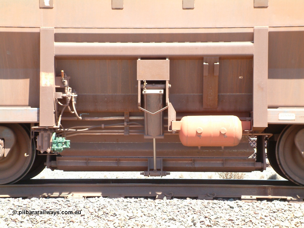 040409 122000
Boodarie, Goninan built Golynx waggon 8416 with serial number 950088-326 from November 2001, is a modified version of the BHP mainline waggons for service on the Goldsworthy system as a bottom discharge waggon, view of the door and actuator handle. 9th of April 2004.
Keywords: 8416;Goninan-WA;Golynx;950088-326;BHP-ore-waggon;