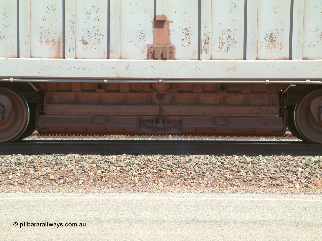 040409 122950
Boodarie, Goldsworthy service bottom discharge Portec USA built ore waggon 345 is one of ten that was purchased second hand in 1992 from Phelps Dodge Copper Mine, believed to be built in 1980s. View of discharge door. 9th April 2004.
Keywords: 345;Portec-USA;BHP-ore-waggon;