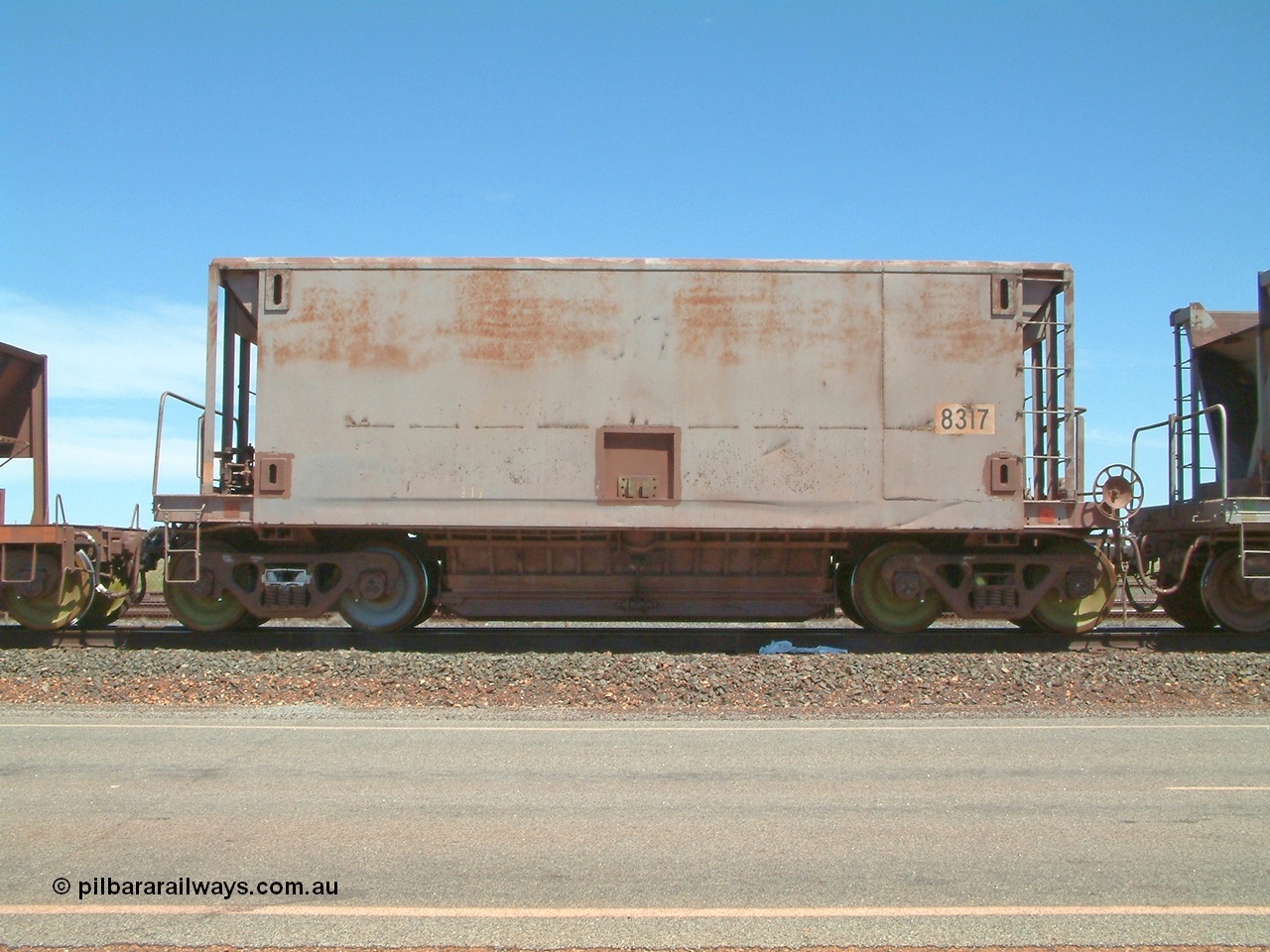 040409 123014
Boodarie, Goldsworthy service bottom discharge Gunderson USA built ore waggon 8317 is one of forty five that was purchased second hand in 1992 from Phelps Dodge Copper Mine, believed to be built in 1970s. 9th April 2004.
Keywords: 8317;Gunderson-USA;BHP-ore-waggon;