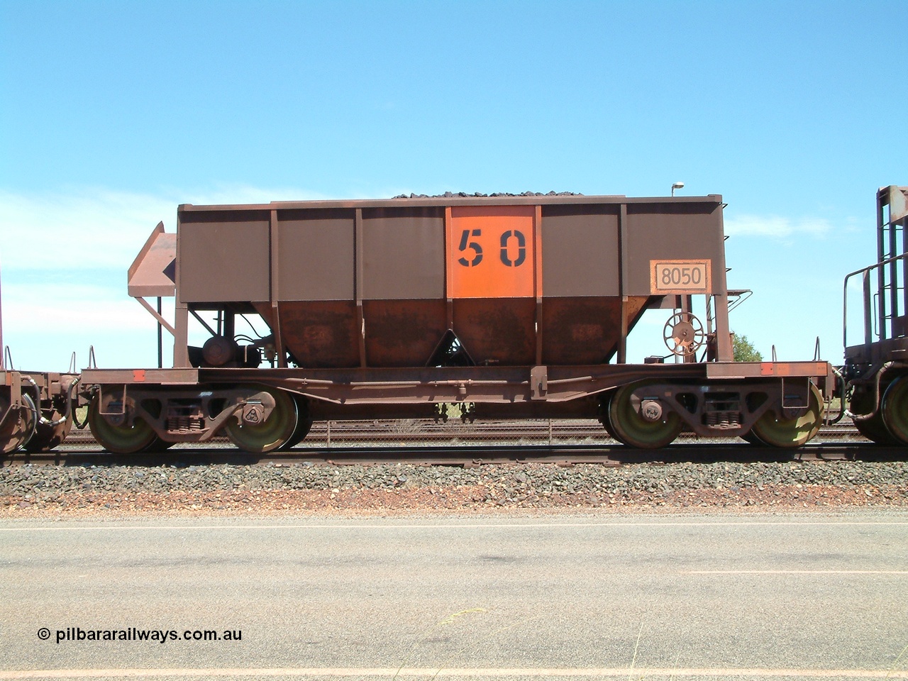 040409 123032
Boodarie, Goldsworthy service bottom discharge Tomlinson Steel WA built ore waggon 8050. 9th April 2004.
Keywords: 8050;Tomlinson-Steel-WA;GML-waggon;BHP-ore-waggon;