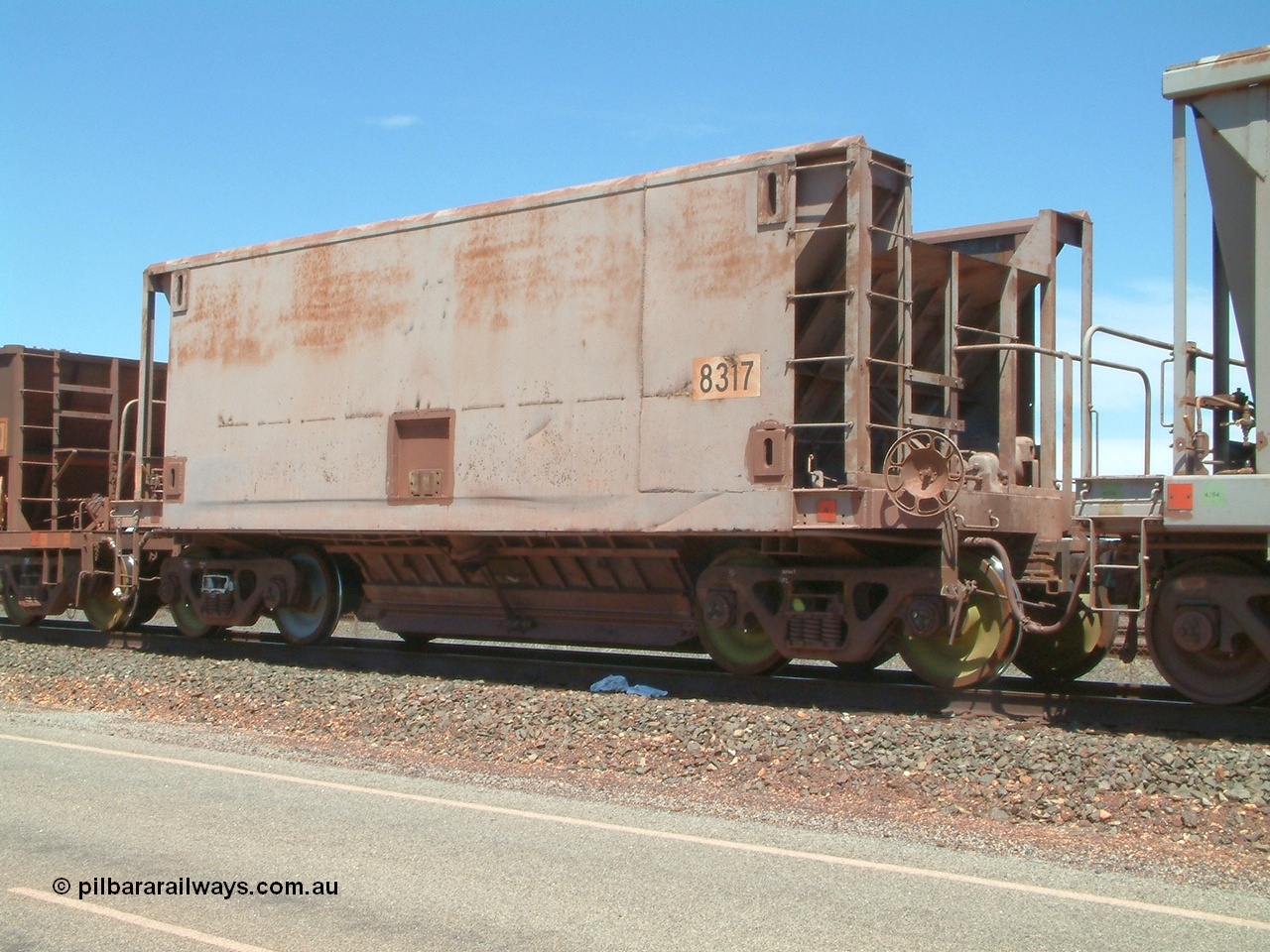 040409 123108
Boodarie, Goldsworthy service bottom discharge Gunderson USA built ore waggon 8317 is one of forty five that was purchased second hand in 1992 from Phelps Dodge Copper Mine, believed to be built in 1970s. 9th April 2004.
Keywords: 8317;Gunderson-USA;BHP-ore-waggon;