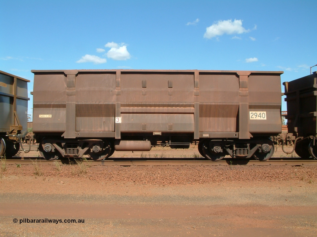 040412 143710
Nelson Point, Goninan built, Lynx Engineering designed ore waggon 2940 are known as Golynx waggons, one of 345 such waggons constructed during 2001 out of 3CR12 stainless steel in an effort to eliminate painting and to reduce wear on the waggon body. 12th April 2004.
Keywords: 2940;Goninan-WA;Golynx;BHP-ore-waggon;