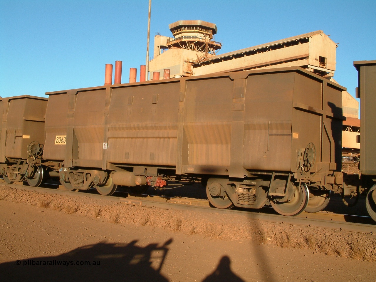 040815 165436
Nelson Point Car Dumper 3, a Goninan built replacement ore waggon, numbered 2063, one of a batch of 345 waggons built to the new Lynx Engineering design known as the Golynx waggons with 3CR12 stainless steel in a bid to eliminate painting to reduce wear on the waggon body. Serial 950088-190, build date 04/2001. 15th August 2004.
Keywords: 2063;Goninan-WA;Golynx;BHP-ore-waggon;