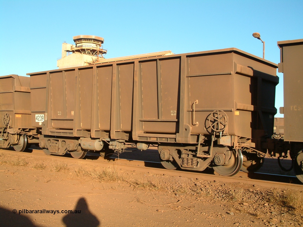 040815 165832
Nelson Point Car Dumper 3, a new Goninan built ore waggon 4239, one of 126 such waggons constructed during 1997 out of 3CR12 stainless steel in an effort to eliminate painting and to reduce wear on the waggon body. Note the rounded bottom edge and tapered floor, this design was designated HC7081. 15th August 2004.
Keywords: 4239;Goninan-WA;BHP-ore-waggon;