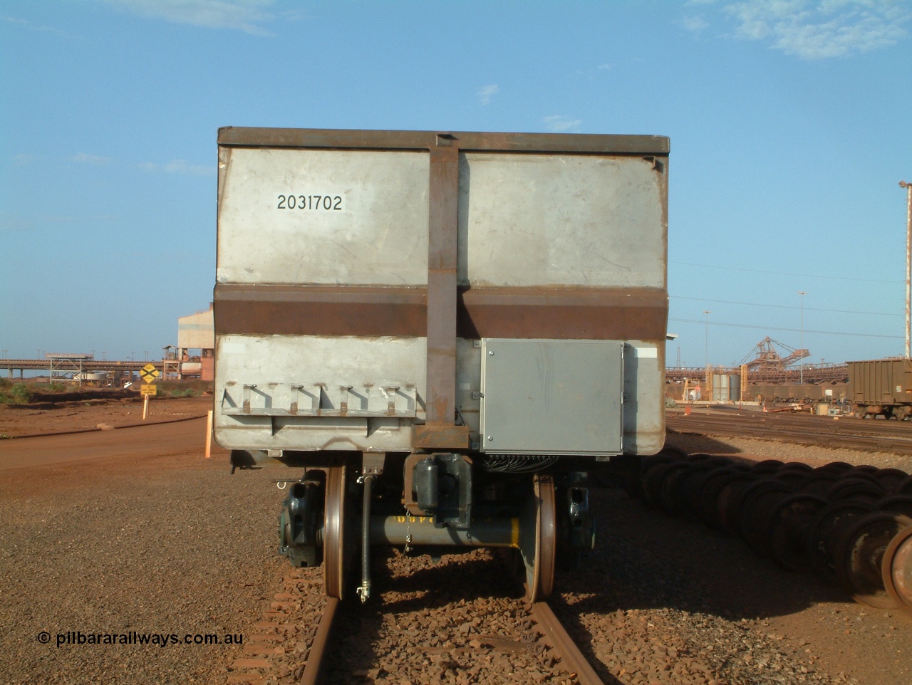 041225 064521
Nelson Point Ore Car Repair Shops, brand new Bradken NSW built ore waggon and type leader 9100 asset number 2031702. These waggons are the latest additions to the fleet with 20 on order in total. They are made from the same 5Cr12Ti steel that the Goninan Golynx waggons are made. 9100 has been set up for use as a 'test' waggon with load sensors located all over it. 25th December 2004.
Keywords: 9100;Bradken-NSW;BHP-ore-waggon;