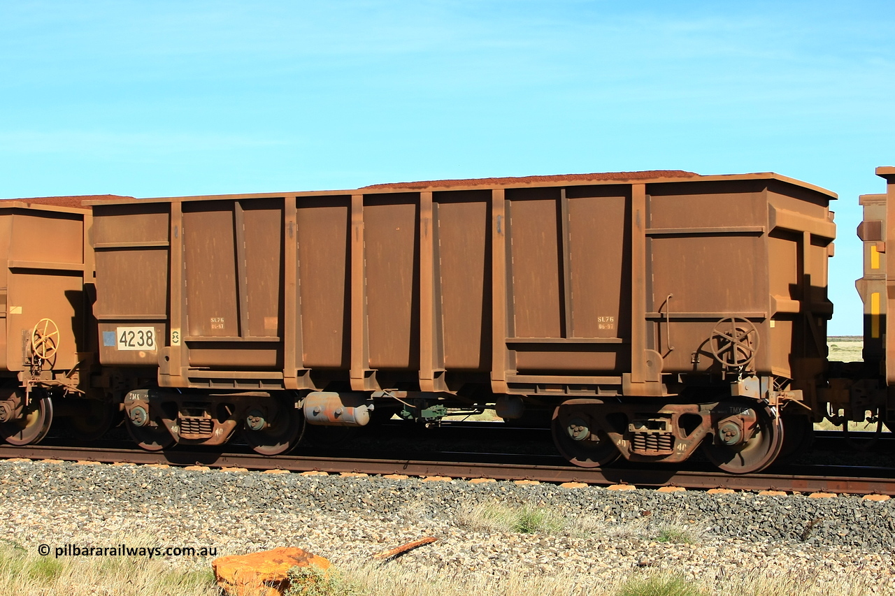 110620 2042r
Walla Siding, empty BHP ore waggon 4238 is a Goninan WA build from an order of one hundred and twenty-six waggons in 1997 using 3CR12 stainless steel in an effort to eliminate internal painting and reducing wear on the waggon body, these were designated HC7081. 20th of June 2011.
Keywords: 4238;Goninan-WA;HC7081;BHP-ore-waggon;