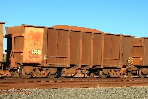 2683 Comeng 110620 2456
Walla, loaded BHP ore waggon 2683, originally built in 1971 by Comeng WA as part of a batch of four hundred waggons. The walls in the ribs have been resheeted. Still has the original white end for rotary coupler, original number and weight. June 20, 2011.
Keywords: 2683;Comeng-WA;BHP-ore-waggon;