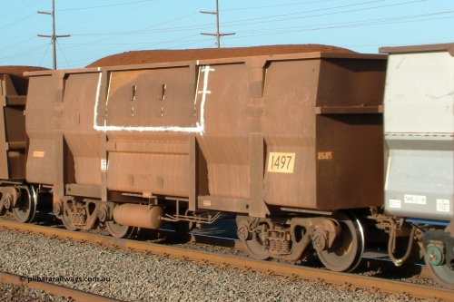 1497 Goninan 041001 165408
Redbank, loaded BHP Iron Ore waggon 1497, a Goninan built replacement body which has also had side repairs. October 1, 2004.
Keywords: 1497;Goninan-WA;BHP-ore-waggon;