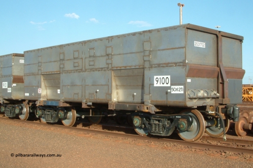 9100 Bradken 041225 064541
Nelson Point Ore Car Repair Shops, brand new Bradken NSW built ore waggon and type leader 9100 asset number 2031702 and 9101 behind it. These waggons are the latest additions to the fleet with 20 on order in total. They are made from the same 5Cr12Ti steel that the Goninan Golynx waggons are made. 9100 has been set up for use as a 'test' waggon with load sensors located all over it. 25th December 2004.
Keywords: 9100;Bradken-NSW;BHP-ore-waggon;