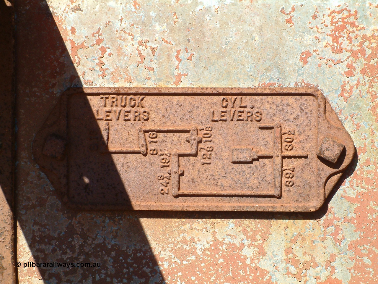 040806 101934
Flash Butt yard, heavily stripped down riveted waggon 206, possible original ballast waggon, number 206 was originally a waggon in the 'Camp Train' and appears to have USA origin, view of brake lever arrangement.
