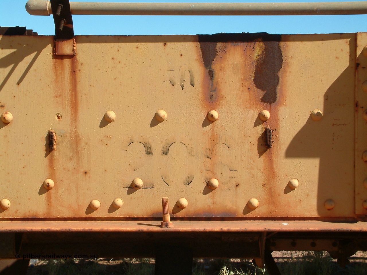 040806 101952
Flash Butt yard, heavily stripped down riveted waggon 206, possible original ballast waggon, number 206 was originally a waggon in the 'Camp Train' and appears to have USA origin, view of number board and 50 t load stencil.
