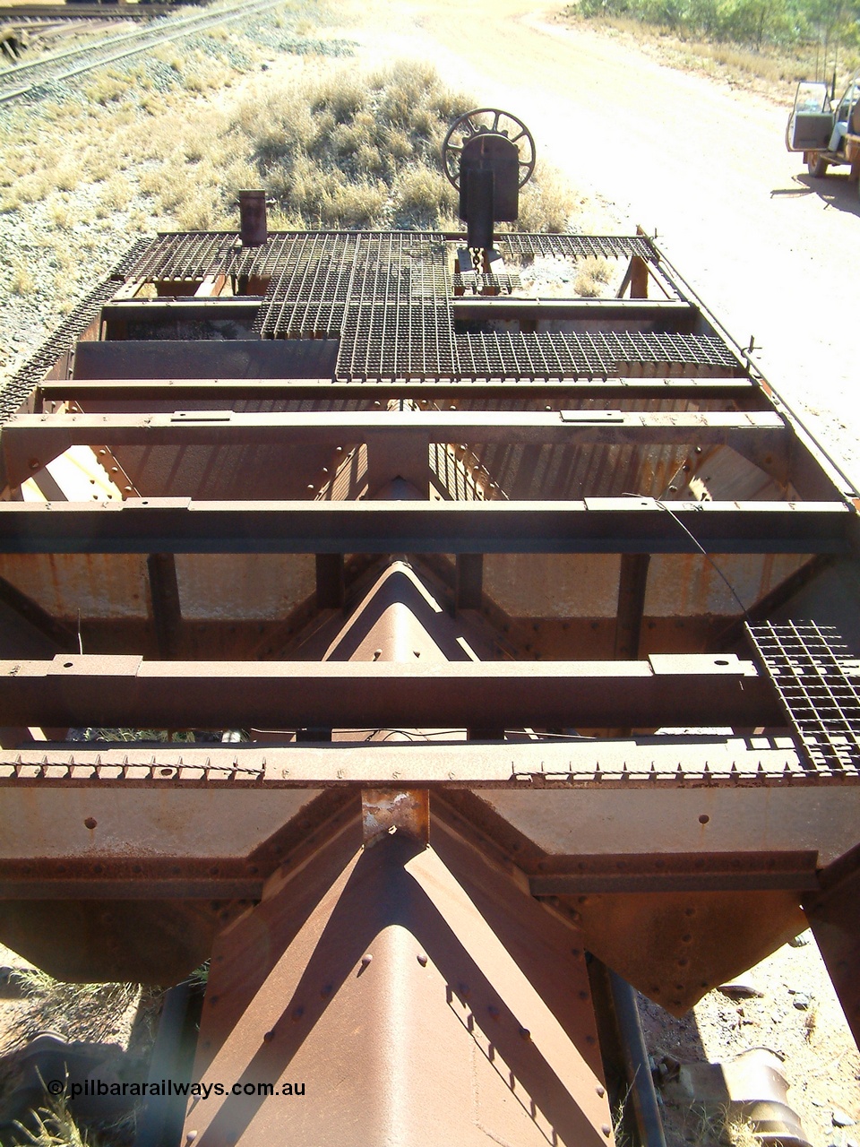 040806 102110
Flash Butt yard, heavily stripped down riveted waggon 206, possible original ballast waggon, number 206 was originally a waggon in the 'Camp Train' and appears to have USA origin, view of the removed deck showing chutes.
