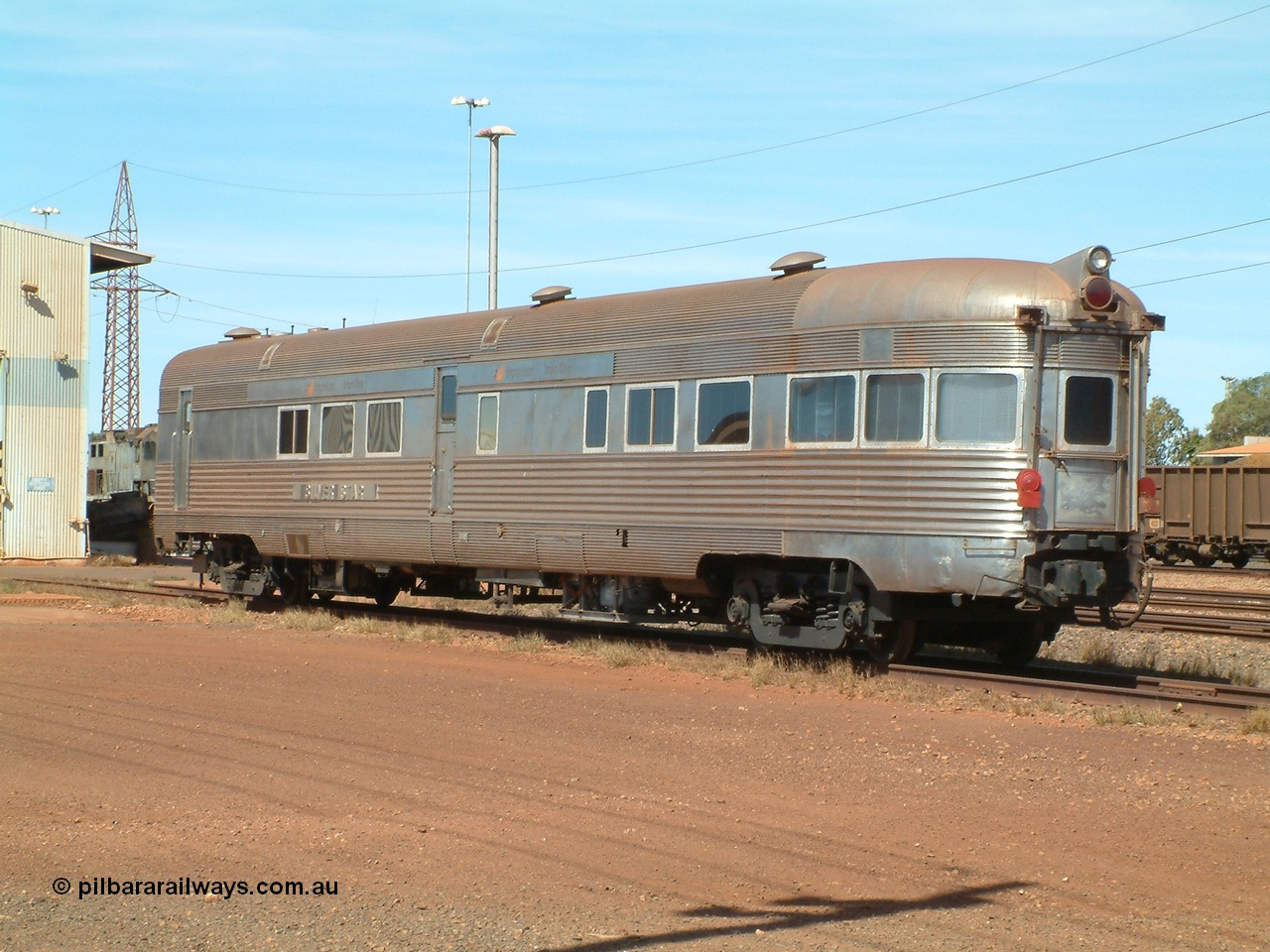 040912 142134
Nelson Point, Silver Star observation coach, 'Sundowner', 3/4 view from rear end. Originally built by E. G. Budd in 1939 numbered 301 as the Silver Star as a diner-parlour-observation coach on the Chicago, Burlington and Quincy Railroad's General Pershing Zephyr train from the 1930s and 1940s. Donated to Mt Newman Mining Co. by AMAX an original joint venture partner to commemorate the projects first 100 million tonnes of iron ore railed between Mount Whaleback mine and the Port Hedland port.
Keywords: Silver-Star;EG-Budd;Sundowner;General-Pershing-Zephyr;301;