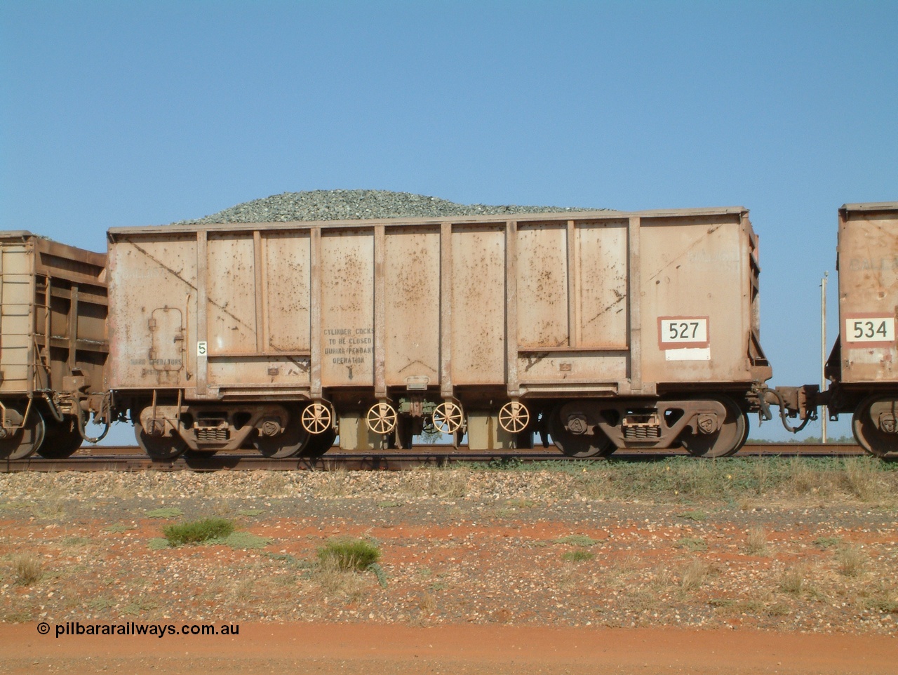 041012 082953
Bing Siding, one of one hundred and forty four original Oroville Dam 91 ton ore waggons built by Magor USA in 1963, sold to Mt Newman Mining in 1968, 527, seen here converted to a ballast car. Note the weld line where the internal plates are for bottom discharge of ballast.
