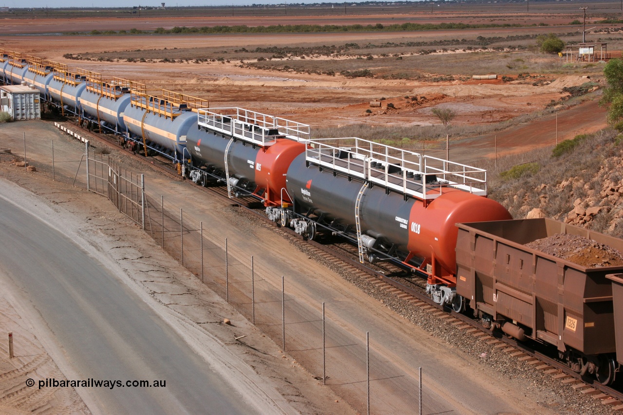 050315 0233
Redbank Bridge, elevated view of empty 116 kL fuel tanks all built by Comeng in both NSW and WA, on the rear of a loaded ore train arriving into Nelson Point yard, waggons include 0018, 0015, 0017, 0012, 0016, 0014, 0013, 0011 and 0010.
Keywords: Comeng-WA;Comeng-NSW;BHP-tank-waggon;