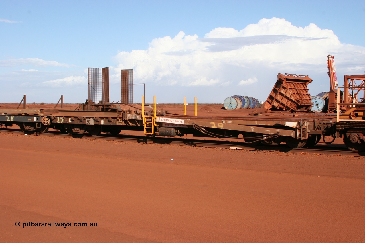 050319 0142
Nelson Point, rail recovery and transport train, 1st lead off waggon 6011, built by Scotts of Ipswich 04-09-1970, the mesh guarding is for the winch cable. The chute arrangement for the discharging and recovery of rail is visible.
Keywords: Scotts-Qld;BHP-rail-train;