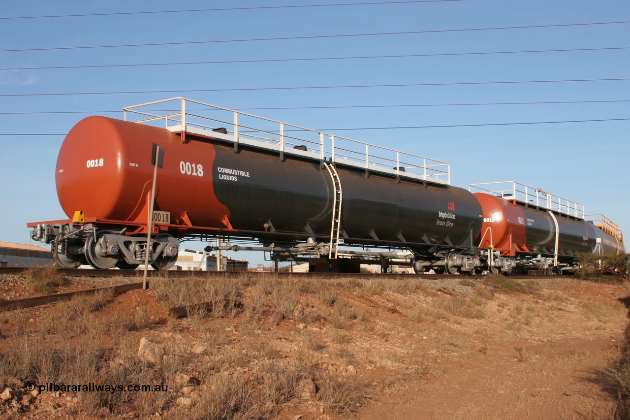 050410 0545
Nelson Point, tanker filling area, fuel tank waggons 0018 a Comeng WA built 114 kilolitre tank waggon, one of a batch of three built in 1974-75 and 0015 a Comeng NSW built 112 kilolitre tank waggon, one of a batch of four built in 1972 and both wearing the newer corporate 'Earth' livery of BHP Billiton Iron Ore.
Keywords: Comeng-WA;BHP-tank-waggon;