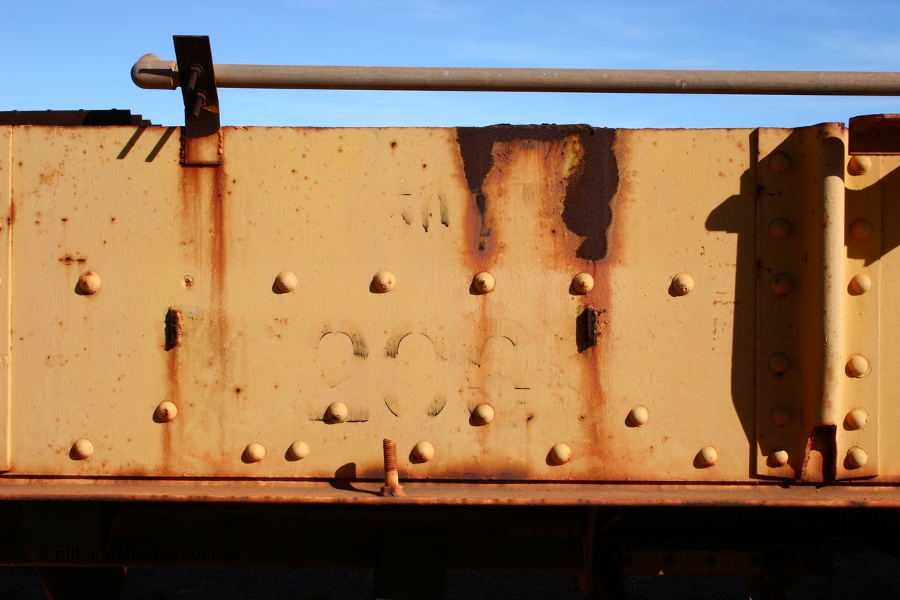 050518 2119
Flash Butt yard, heavily stripped down riveted waggon 206, possible original ballast waggon, number 206 was originally a waggon in the 'Camp Train' and appears to have USA origin, view of number board and 50 t load stencil.
Keywords: BHP-flat-waggon;