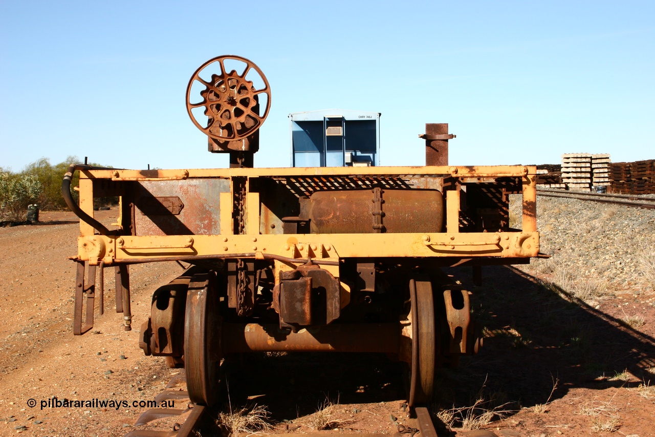 050518 2121
Flash Butt yard, heavily stripped down riveted waggon 206, possible original ballast waggon, number 206 was originally a waggon in the 'Camp Train' and appears to have USA origin, view of handbrake end.
Keywords: BHP-flat-waggon;